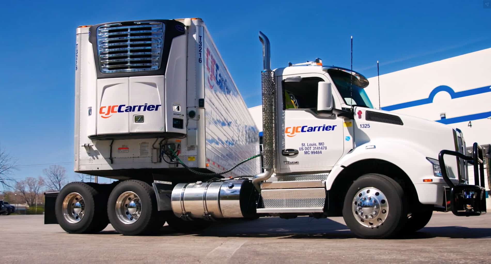 Semi truck making a turn in an L with trailer facing forward