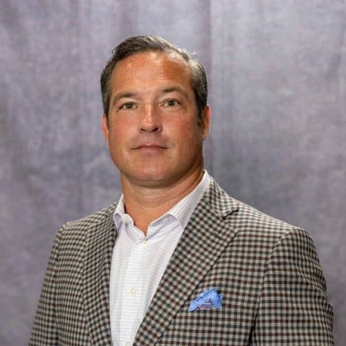 CJC Transport - Chris Connolly, man in a white button up and blazer